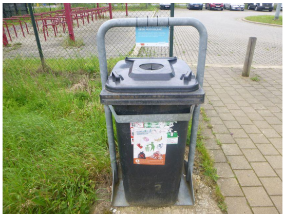 Rubbish bin with warning sign